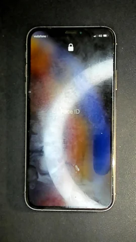 Apple iPhone XS de C****a antes de la reparación de auricular