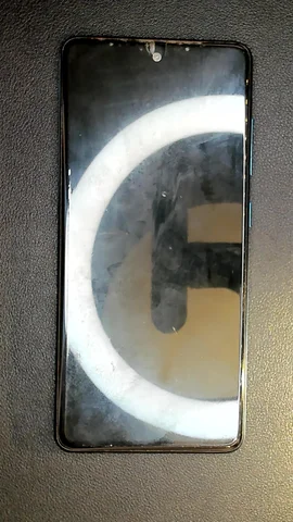 Samsung Galaxy A51 de S*****n antes de la reparación de puerto de carga y micrófono y pantalla